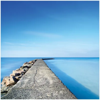 Produktbild von Wallario Memoboard Magnettafel aus Glas, Größe 50 x 50 cm, Motiv Pier am blauen Ozean mit blauem Himmel