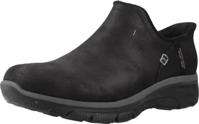 A black Skechers slip-on shoe is shown from a side angle against a white background.