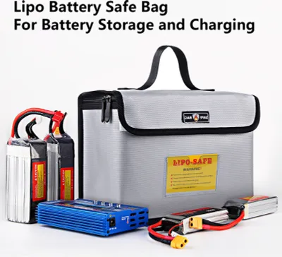 A Lipo battery safe bag with batteries and a charger.