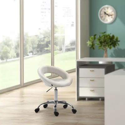 A modern office setting with a large window overlooking a green lawn, a desk with drawers, and a circular cream-colored chair.