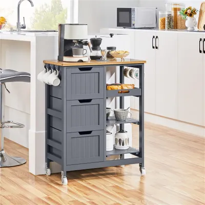 A kitchen island cart with coffee maker and accessories in a kitchen setting.