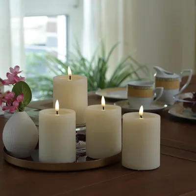 Produktbild von LED Kerzenset UNIQUE - Rustik-Optik - H: 10cm - mit Batterien und Fernbedienung - creme - 4er Set