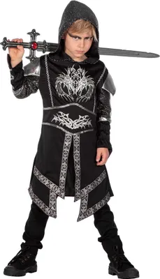 A child wearing a knight costume holding a toy sword.