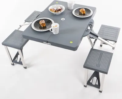A portable picnic table with four attached seats, set up on a white background.