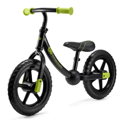 A black and green balance bike is shown against a white background.