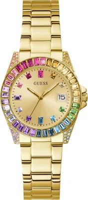 A gold-colored Guess watch with a rainbow-colored bezel and dial, shown against a white background.