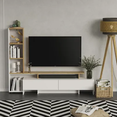 A modern living room setup with a TV stand, TV, bookshelf, and floor lamp.