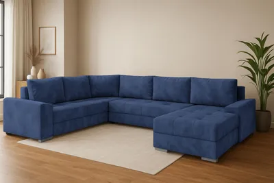 A U-shaped sectional sofa is placed on a rug in a room with wooden flooring and a plain wall.