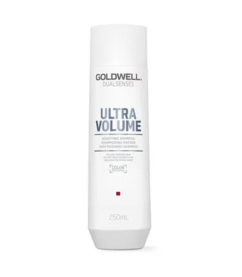 A white bottle of Goldwell Dualsenses Ultra Volume Bodifying Shampoo against a white background.