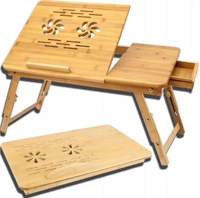 A wooden laptop table with a drawer and ventilation holes is shown. A second, folded table is placed in front of it.