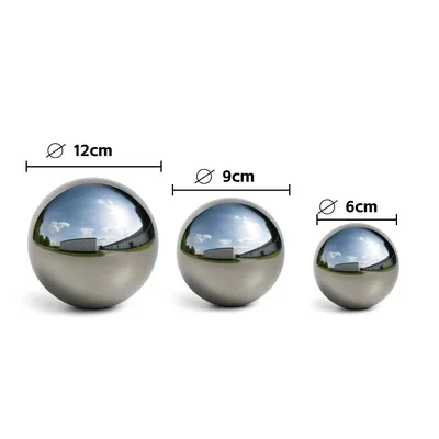 Three polished stainless steel garden spheres of different sizes are displayed against a white background, with their diameters indicated by text labels.