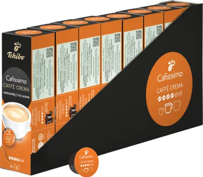 A display box filled with multiple boxes of Tchibo Cafissimo Caffè Crema coffee capsules.