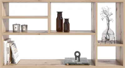 A wooden shelf unit with decorative items like bottles, candles, and books.