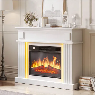 A white electric fireplace with a realistic flame effect and LED lighting, set in a living room.