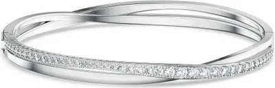 A close-up studio shot of a silver bracelet with clear stones.