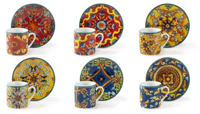 A collection of six espresso cups and saucers, each with a unique, colorful, and intricate pattern.