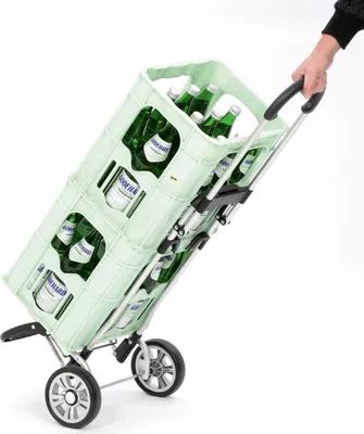 A hand is shown pulling a shopping trolley filled with bottles of water.