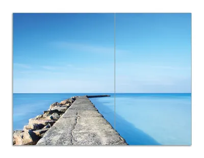 Produktbild von Wallario Herdabdeckplatte aus Glas, Größe 70 x 52 cm 2-teilig, Motiv Pier am blauen Ozean mit blauem Himmel