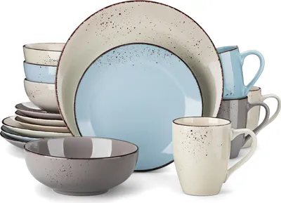 A collection of ceramic plates, bowls, and mugs arranged together.