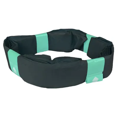 A roll of black trash bags with green ties, arranged in a circle.