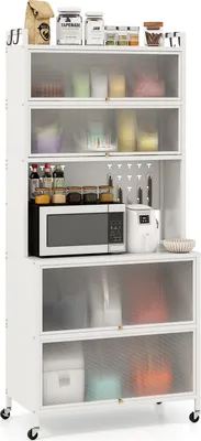 A white kitchen cabinet with multiple shelves and glass doors, filled with various kitchen items including a microwave, rice cooker, jars, and bags.