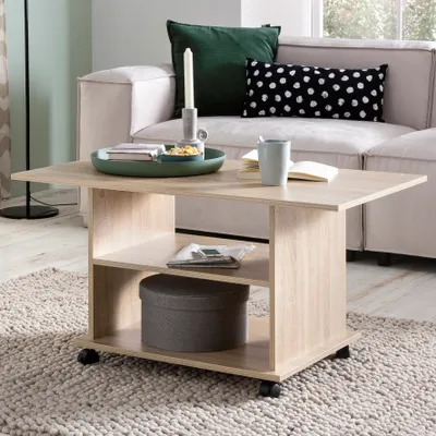 A coffee table with items on it, placed in a living room setting.