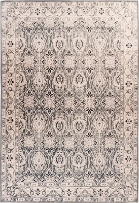 A flat lay of a rectangular rug with a traditional pattern.