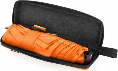 A folded orange umbrella inside its black protective case.