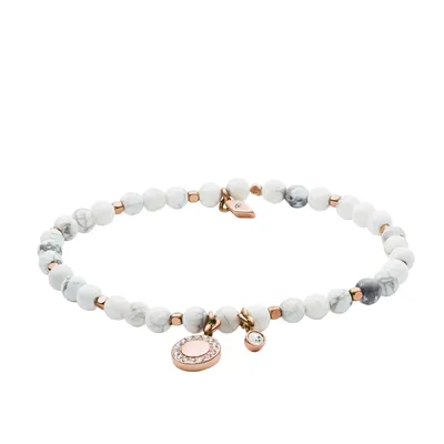 A bracelet made of white and gray beads with rose gold accents and charms.