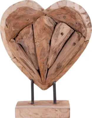 A wooden heart sculpture on a stand.