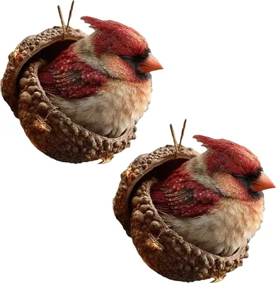 Two decorative ornaments of cardinals nestled in acorn caps, presented against a white background.
