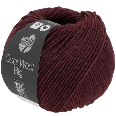 A ball of burgundy yarn with a black label wrapped around it.