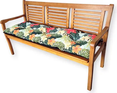 A wooden bench with a colorful floral cushion.