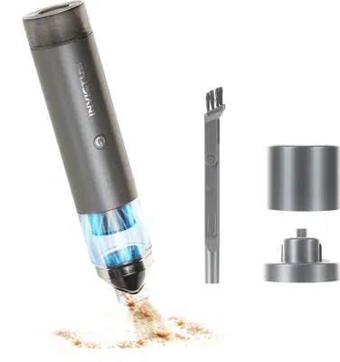 A handheld vacuum cleaner is shown in use, sucking up debris. Accessories are displayed to the right.