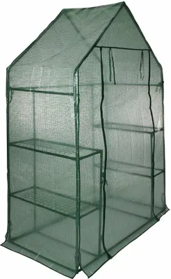 A green greenhouse with shelves.