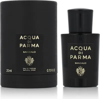 A black perfume bottle and its packaging are shown against a white background.