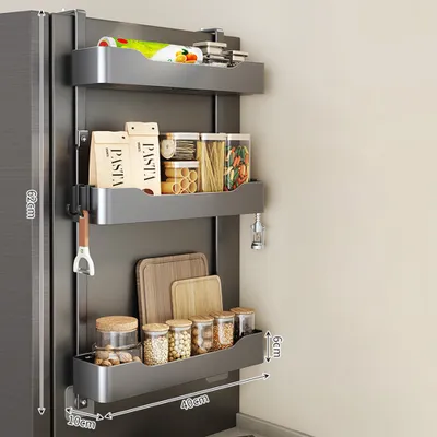 A multi-tiered shelf unit attached to the side of a refrigerator, filled with various kitchen items.