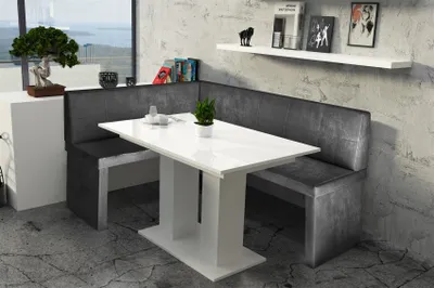 A dining set with a corner bench and table in a modern room setting.