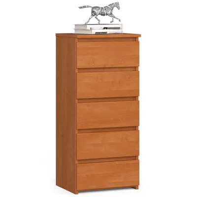 A tall, narrow chest of drawers with five drawers, made of light brown wood, is shown against a white background. A small decorative horse statue and two books are placed on top of the chest.