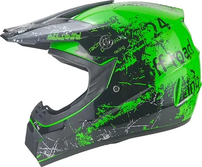 A green and black motocross helmet with a distressed graphic design.