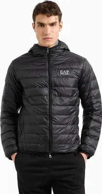 A man wearing a black puffer jacket.