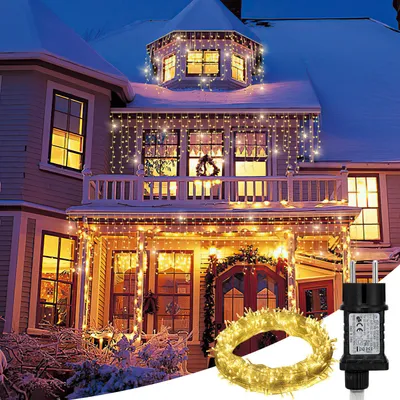 Immagine prodotto di Catena luminosa LED "Ikodm Eisregen" con 600 LED, lunghezza 15 metri, luce bianca calda, 8 modalità, funzione di memoria, 31V. Ideale per decorare finestre, feste e soggiorni
