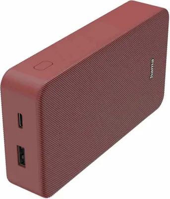 A red power bank with textured surface and ports on the side.