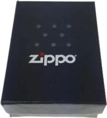 A black Zippo branded box with a pattern of dots and the Zippo logo.