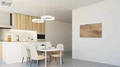 A modern kitchen and dining area with a magnetic board on the wall.