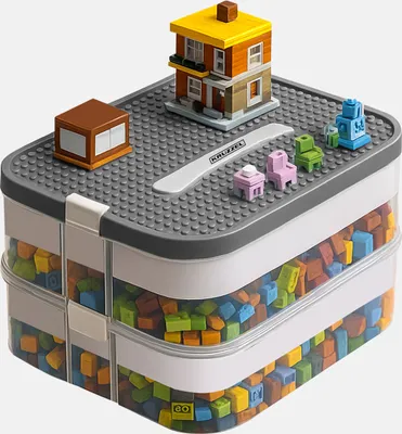 A storage box filled with colorful building blocks, topped with a small building and furniture made from blocks.