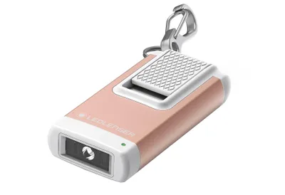 A rose gold LED Lenser keychain flashlight against a white background.