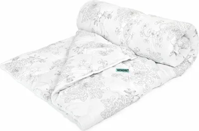 A rolled-up duvet with a floral pattern on a white background.