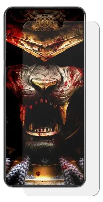 A close-up of a phone screen protector with a graphic of a bloody, armored creature.