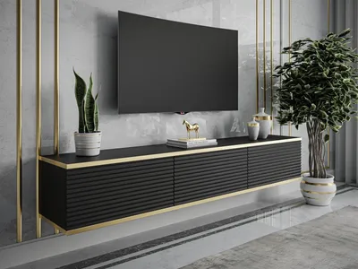 A modern living room setup featuring a wall-mounted TV and a sleek black media console.